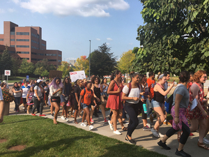 Syracuse University community members protesting President Donald Trump's end to DACA marched across campus toward the Carrier Dome where many Syracuse fans were attending Saturday's football game.